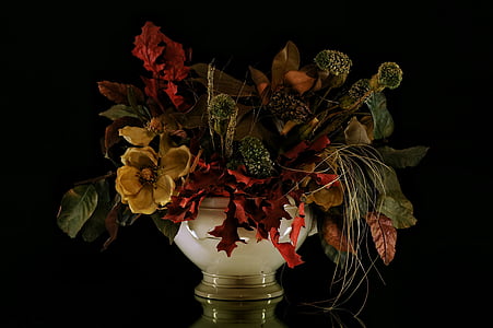 yellow and red faux flower arrangement in white ceramic vase thumbnail