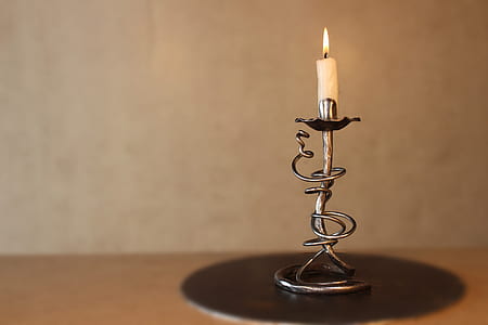 candle on stainless steel stand thumbnail