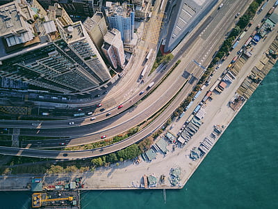 aerial fish eye lens photography of concrete buildings and road thumbnail