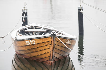 brown and white wooden STA 013 boat on water during daytime thumbnail
