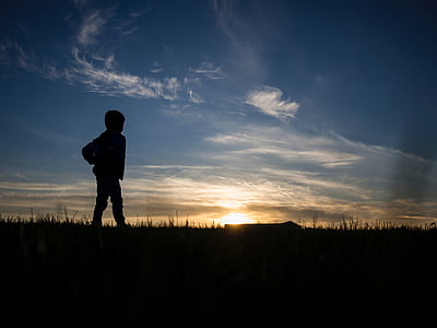 silhouette of boy during golden hour thumbnail