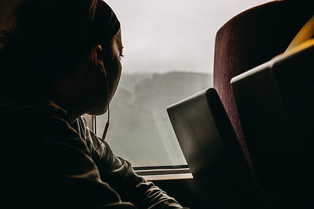 woman inside vehicle facing window thumbnail