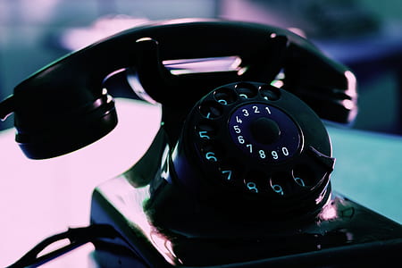 shallow focus photography of black rotary dial phone thumbnail
