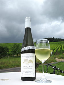 wine bottle beside wine glass thumbnail
