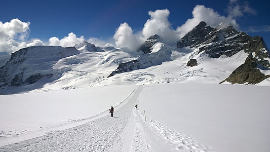 man standing on snow field thumbnail