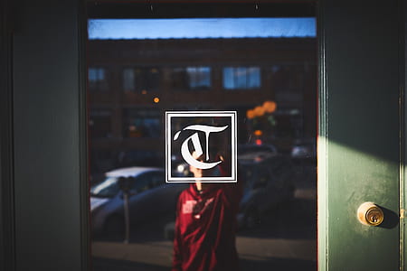 man standing in front of glass door thumbnail