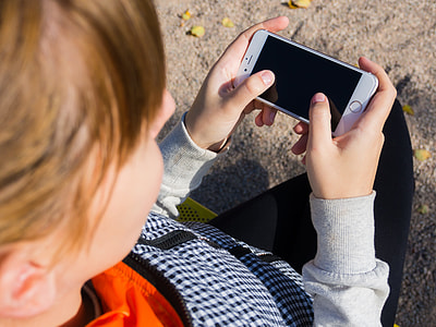 woman holding gold iPhone 6 thumbnail