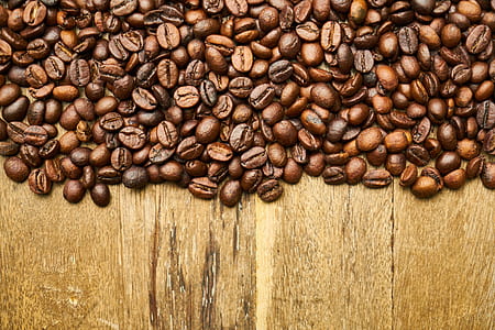 coffee beans on brown table surface thumbnail