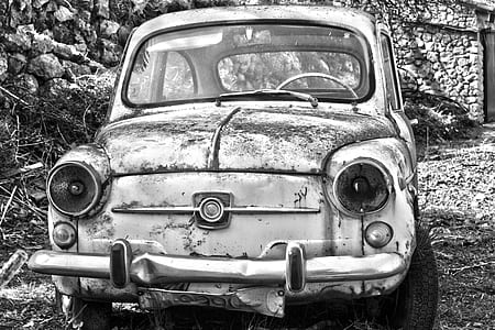 vintage car parked on ruins thumbnail