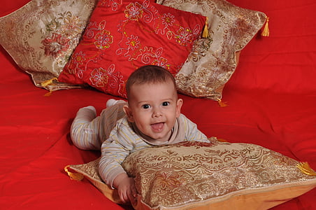 toddler holding pillow thumbnail