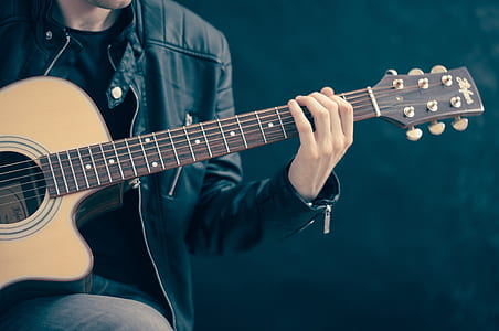 person holding guitar thumbnail