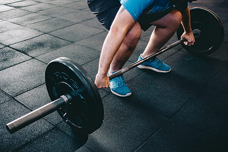 person holding barbell thumbnail
