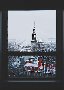 selective color photography of window view of concrete houses and buildings thumbnail