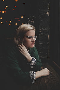 woman leaning on brown wooden board thumbnail