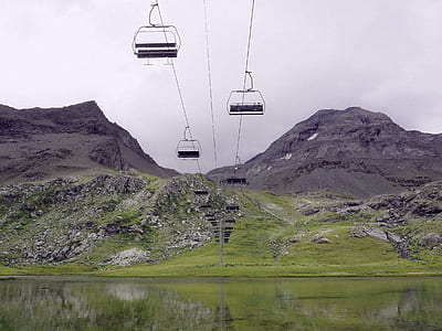 cable car over green grass field thumbnail