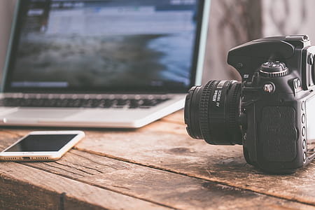 black DSLR camera thumbnail
