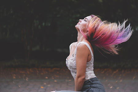 purple haired woman in white laced tank top and blue denim bottoms thumbnail