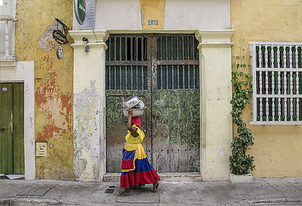 woman wearing yellow, blue, and red dress thumbnail