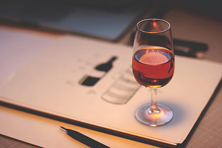 clear short-stemmed glass on white paper thumbnail