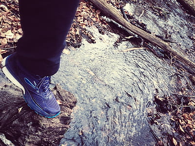 Person in Navy Blue Sweatpants and Blue and White Sneakers thumbnail