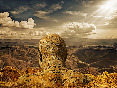 close up photo of human head rock formation wallpaper thumbnail