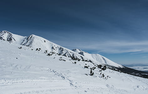 snow-covered mountain under blue sky thumbnail