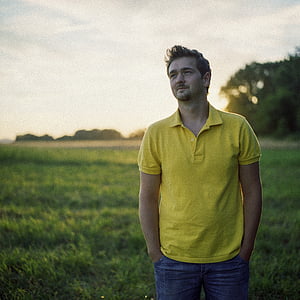 men's yellow polo shirt and blue jeans thumbnail