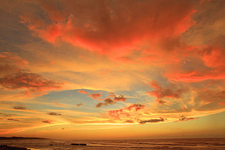 sea under orange and blue sky thumbnail
