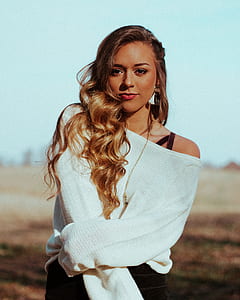 woman standing on desert during daytimwe thumbnail