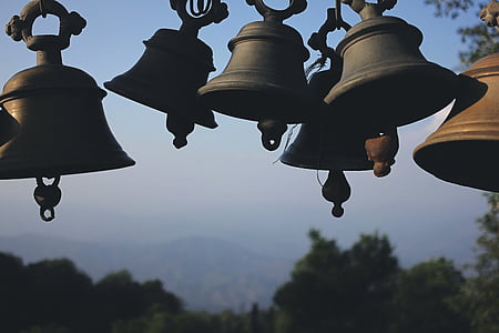 selective focus photography of metal bells thumbnail
