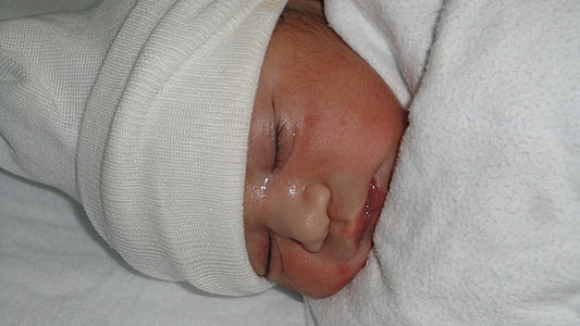 toddler sleeping while wearing white beanie thumbnail