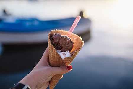 Man and Woman Holding Ice Creams thumbnail