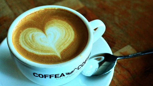 white ceramic cup on white saucer thumbnail