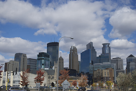 high-rise buildings under white clouds at daytime thumbnail