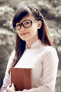 shallow focus photography of smiling woman wearing black eyeglasses thumbnail