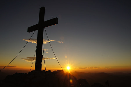 silhouette of cross decor during sunset thumbnail