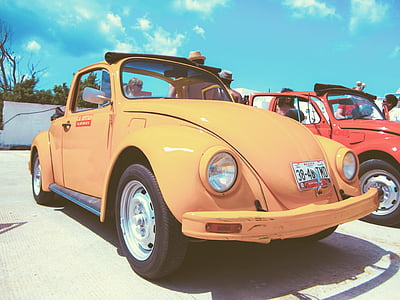 yellow Volkswagen Beetle convertible thumbnail