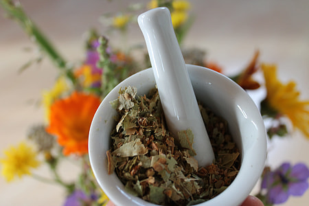 white marble mortal and pestle with leaves thumbnail