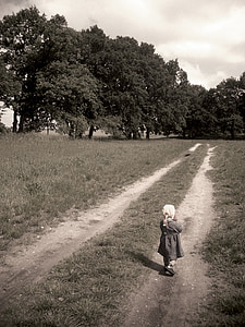 child walking toward forest thumbnail