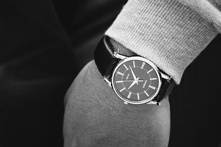 Person Wearing Round Silver Analog Watch With Black Leather Strap thumbnail