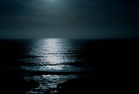 body of water with moon's light reflecting on it thumbnail