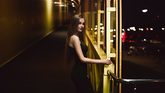 woman in black halter-top dress thumbnail