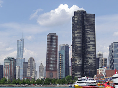 long-angle photography of high-rise buildings under cumulus clouds and blue calm sky thumbnail