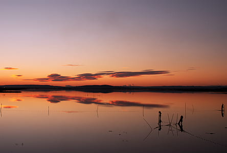 body of water during sunset thumbnail