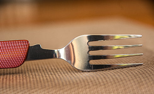 gray stainless steel fork in closeup photography thumbnail