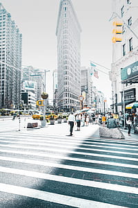 people walking in front of flatiron building thumbnail