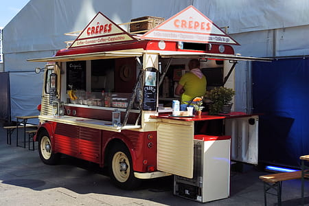 red and white wooden food stall near gray tent thumbnail