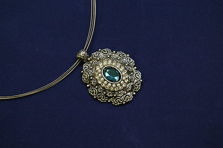 oval green gemstone encrusted gold-colored pendant necklace thumbnail