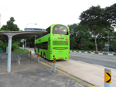 green bus on waiting shed thumbnail