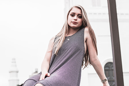 woman wearing grey sleeveless dress thumbnail
